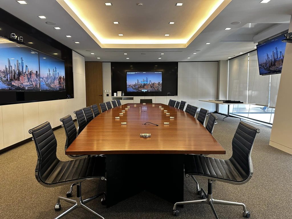 Crestron control system programming implemented in a Tapestry conference room by IVCi.