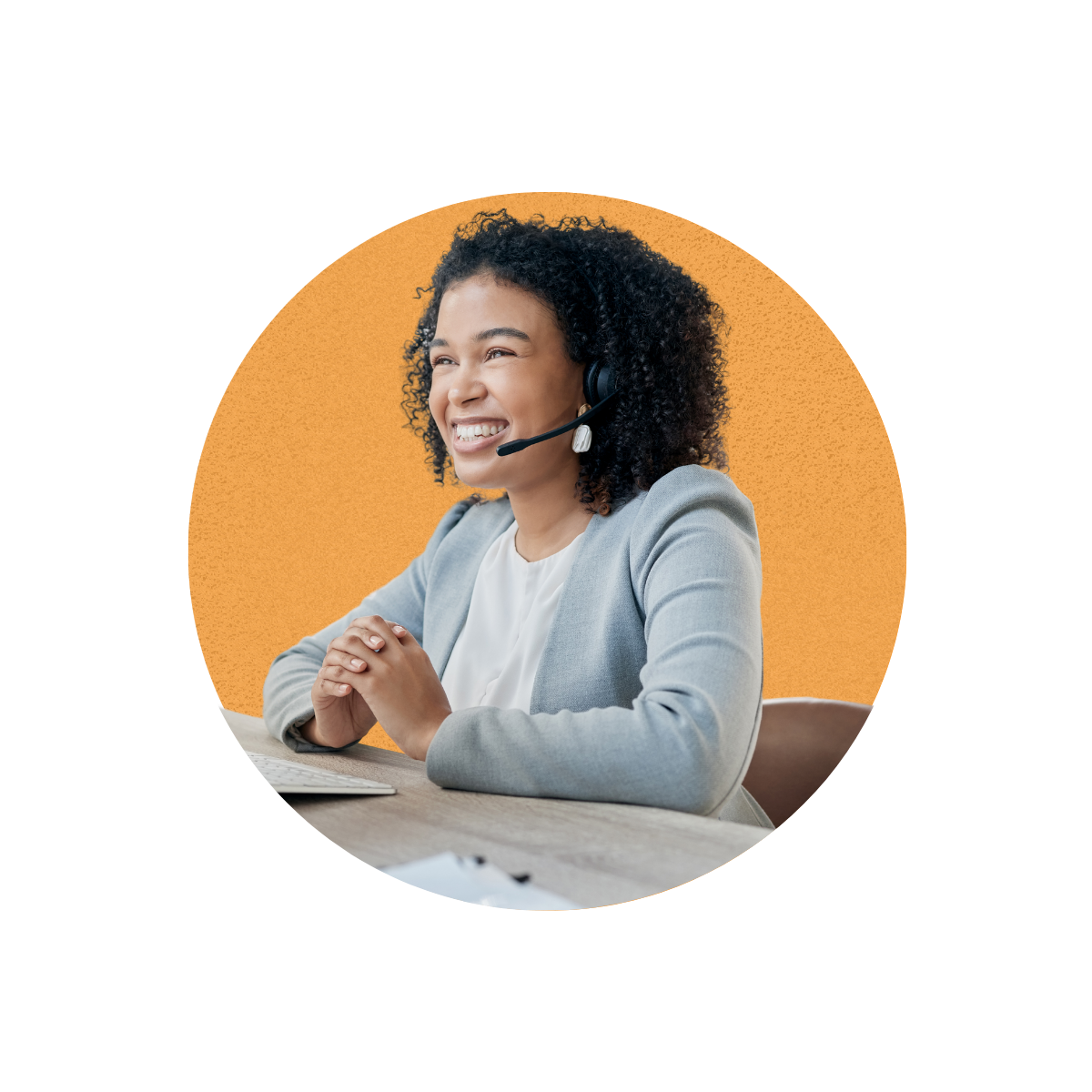 A woman receiving a call on a headset | IVCi
